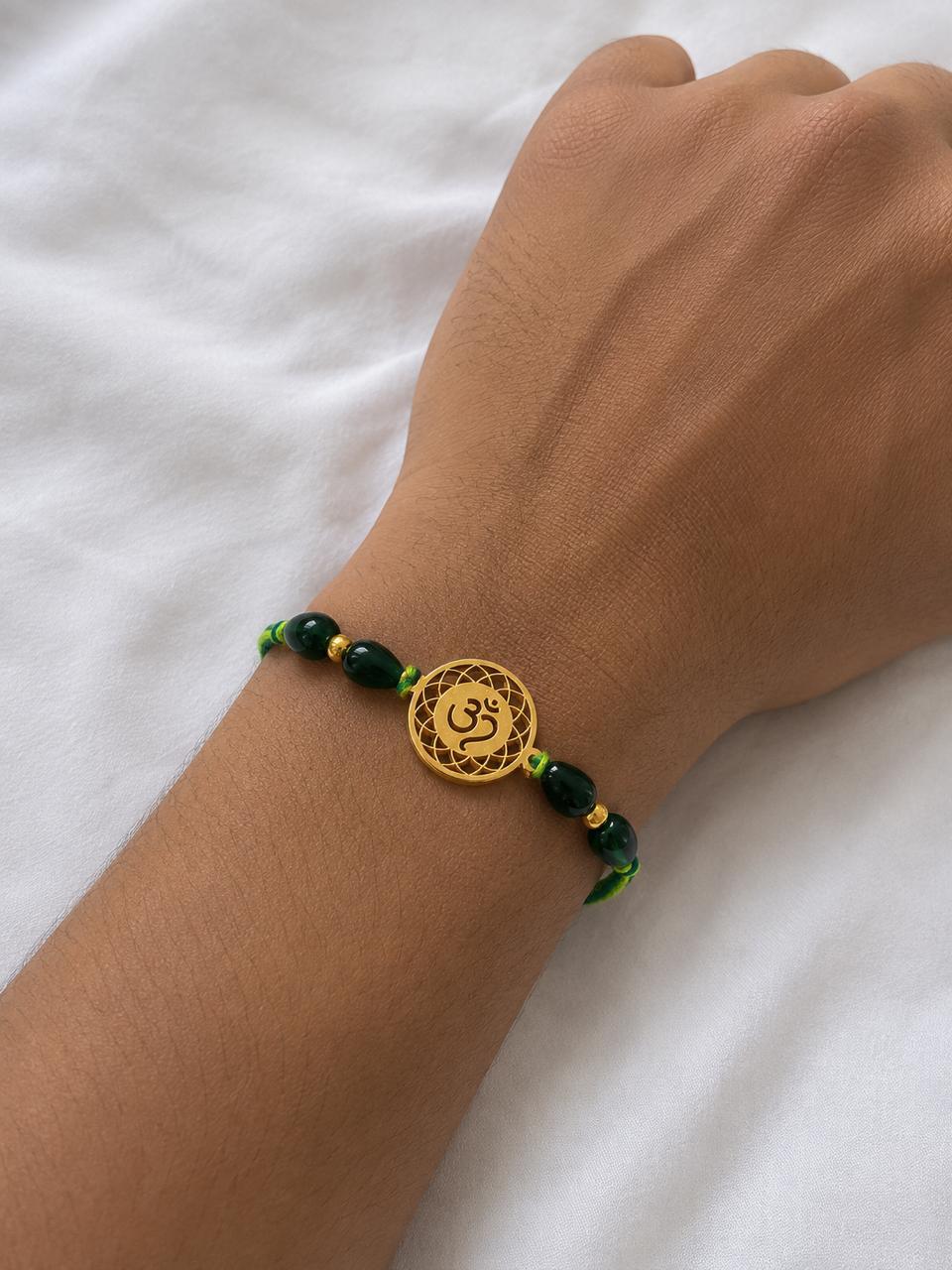 Om Symbol Rakhi- Silver and gold plated Rakhi