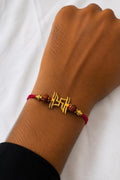 Sacred Swastik Rakhi With Rudraksha - Silver And Gold Plated